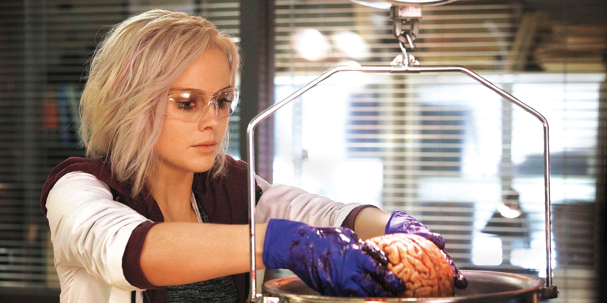 Liv Moore in the lab holding a brain in iZombie.