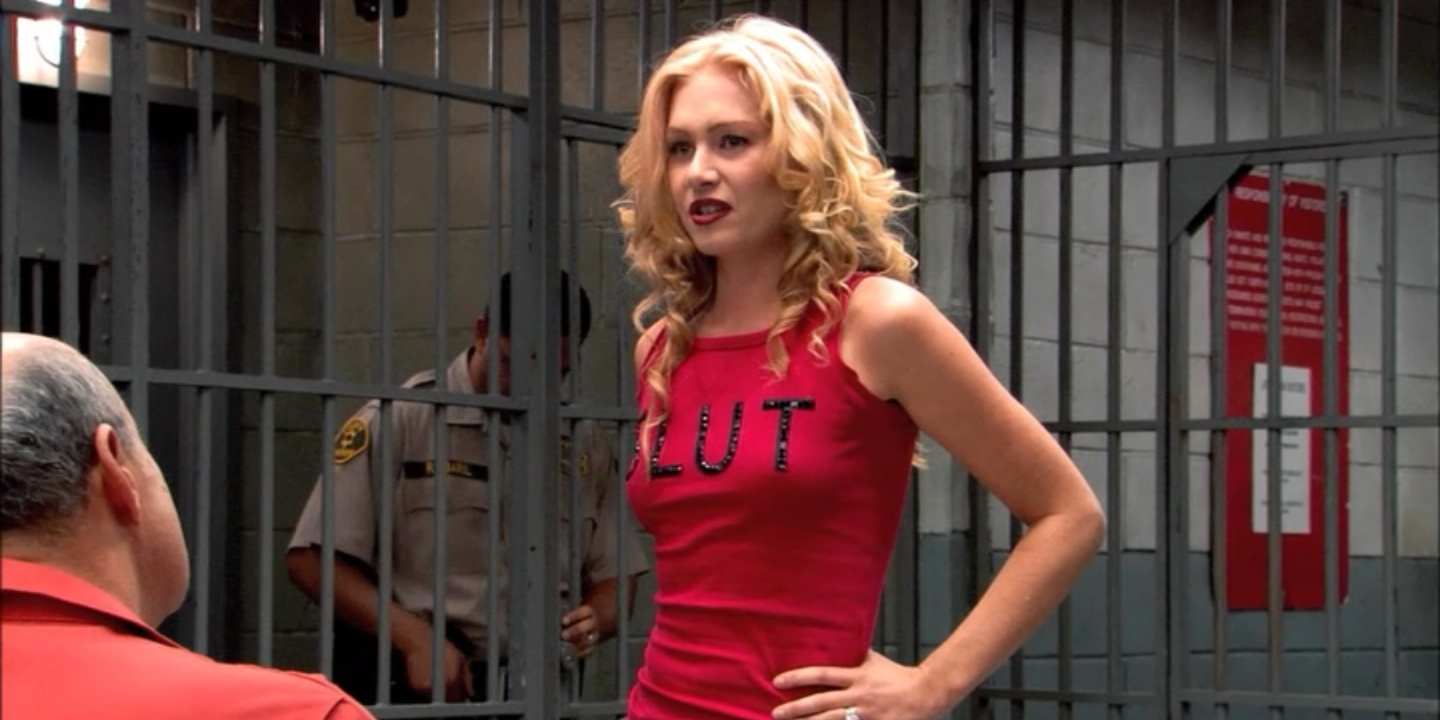Lindsay in prison wearing a top that says "SLUT" in Arrested Development