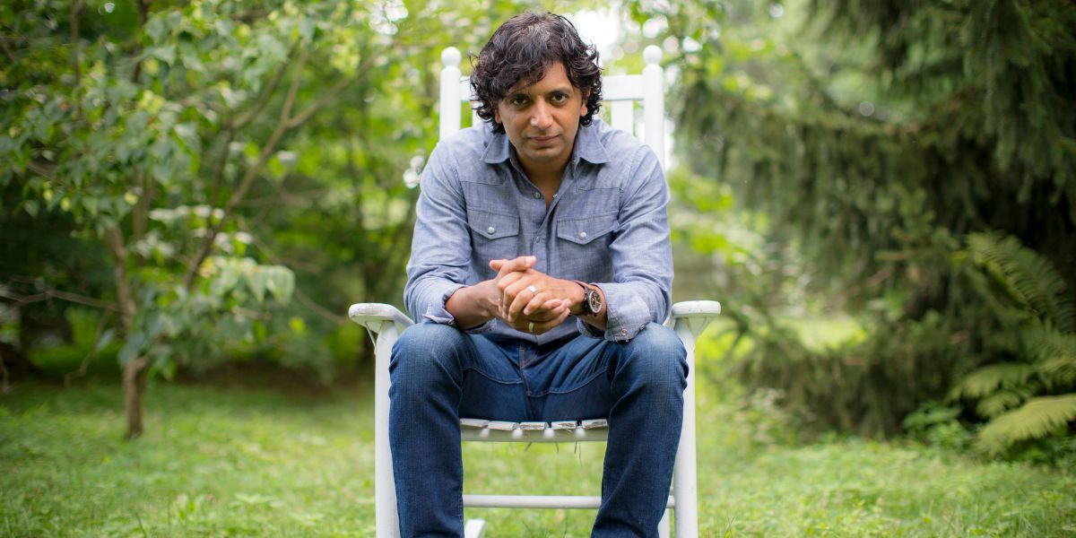 M. Night Shyamalan sitting in a chair looking into the camera