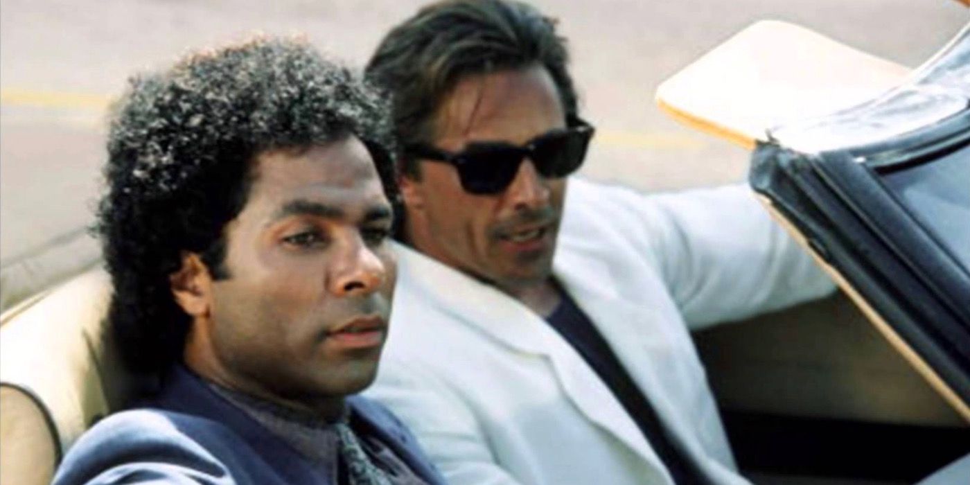 Two men ride in a convertible from Miami Vice 