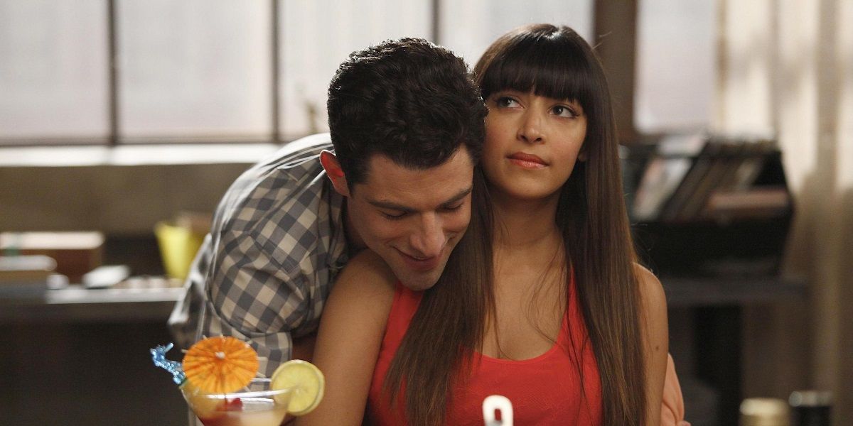Schmidt and Cece standing together in the loft in New Girl