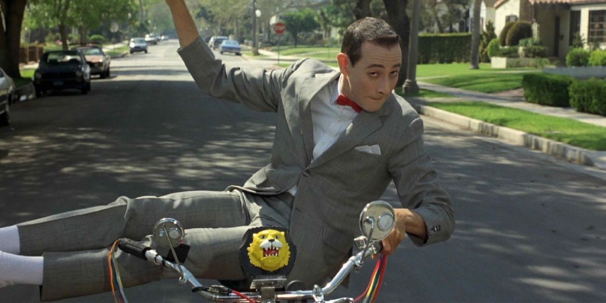 Pee-wee sitting sideways on his bike in Pee Wee's Big Adventure