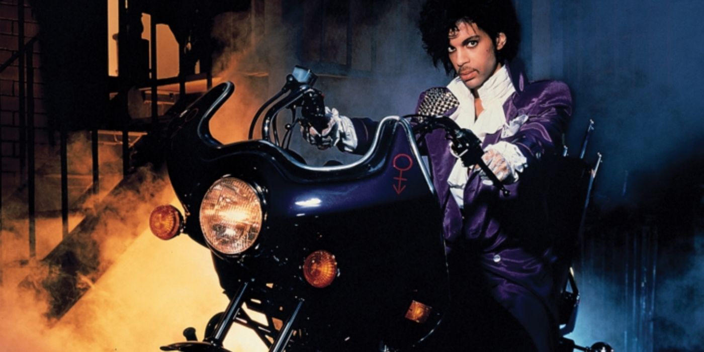 Prince sits on his motorcycle on the cover of Purple Rain
