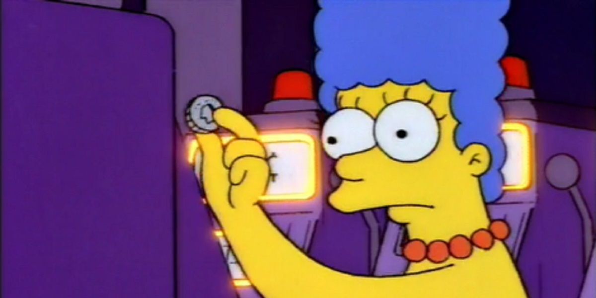 Marge holding a nickle at the casino