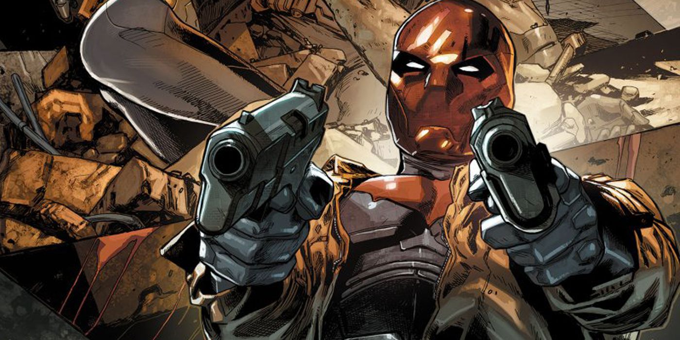 Jason Todd as Red Hood, with guns pointed at the screen