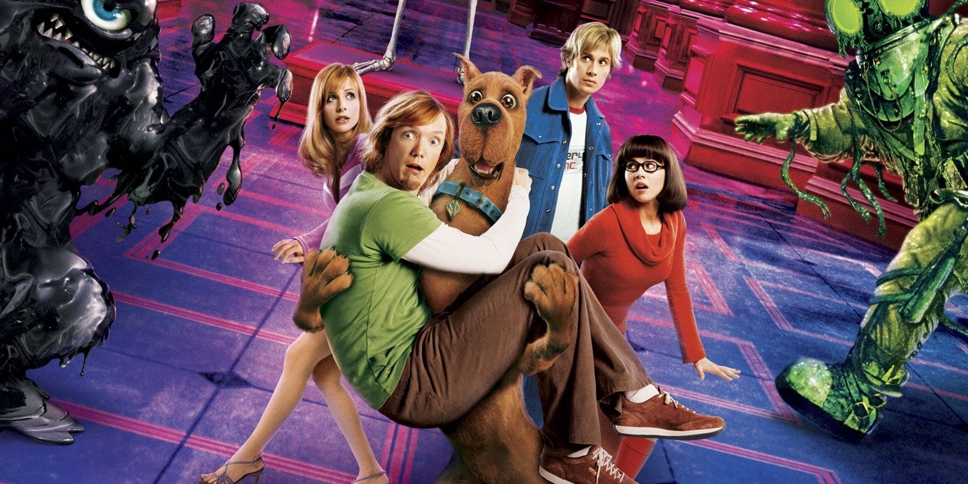 The live action Scooby Doo movie characters and monsters in a cropped poster image