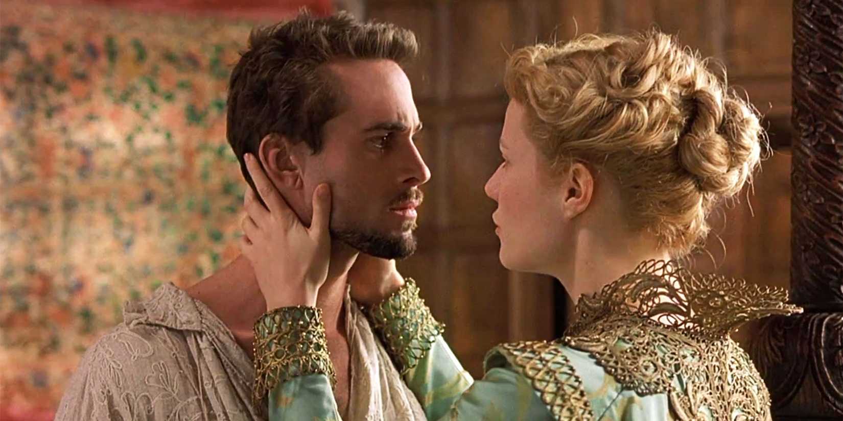 Gwyneth Paltrow as Viola holding Joseph Fiennes as Shakespeare's face lovingly in Shakespeare in Love.