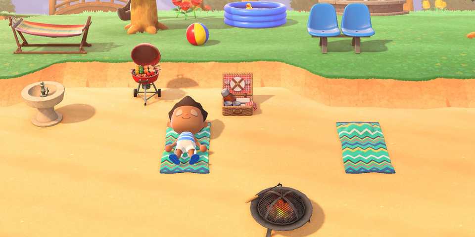 Animal Crossing New Horizons character resting on a beach towel