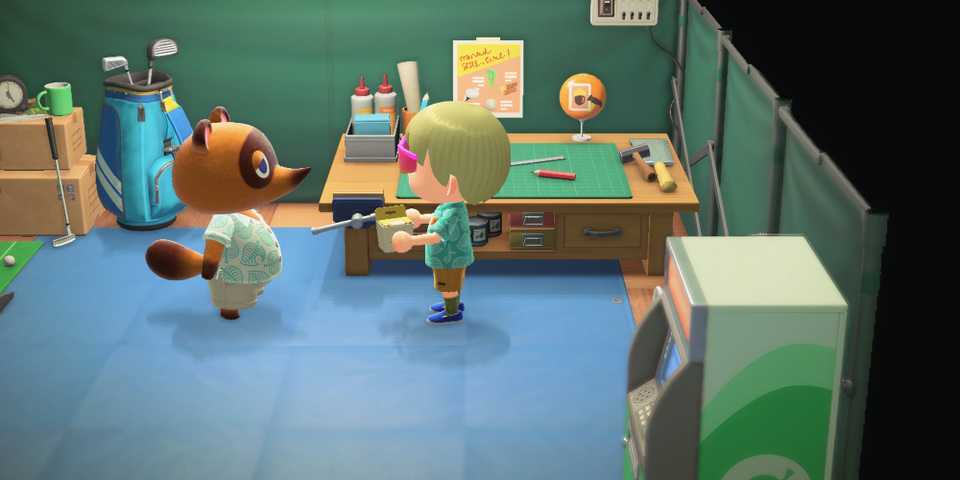 Talking to Tom Nook in his tent in the plaza at the start of Animal Crossing New Horizons