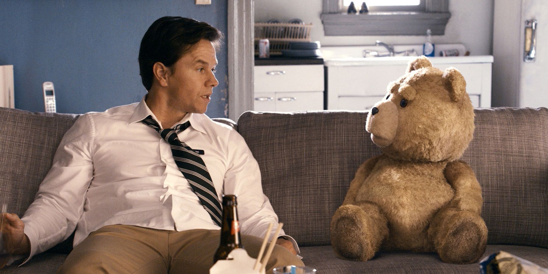 John and Ted sitting on the couch in Ted