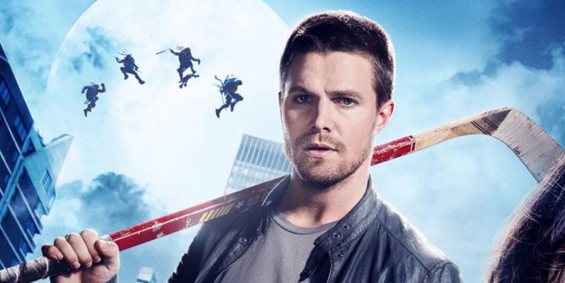 Stephen Amell as Casey Jones holds his hockey stick in Teenage Mutant Ninja Turtles: Out of the Shadows 
