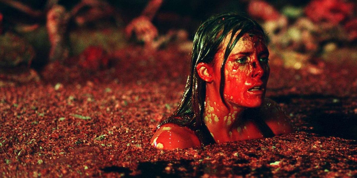 A woman covered in blood in The Descent
