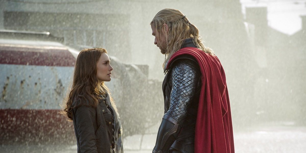 Natalie Portman and Chris Hemsworth as Thor and Jane looking at each other