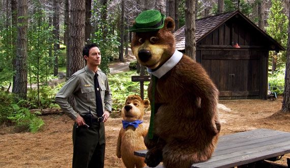 Tom Cavanagh lectures Yogi Bear about stealing picnic baskets
