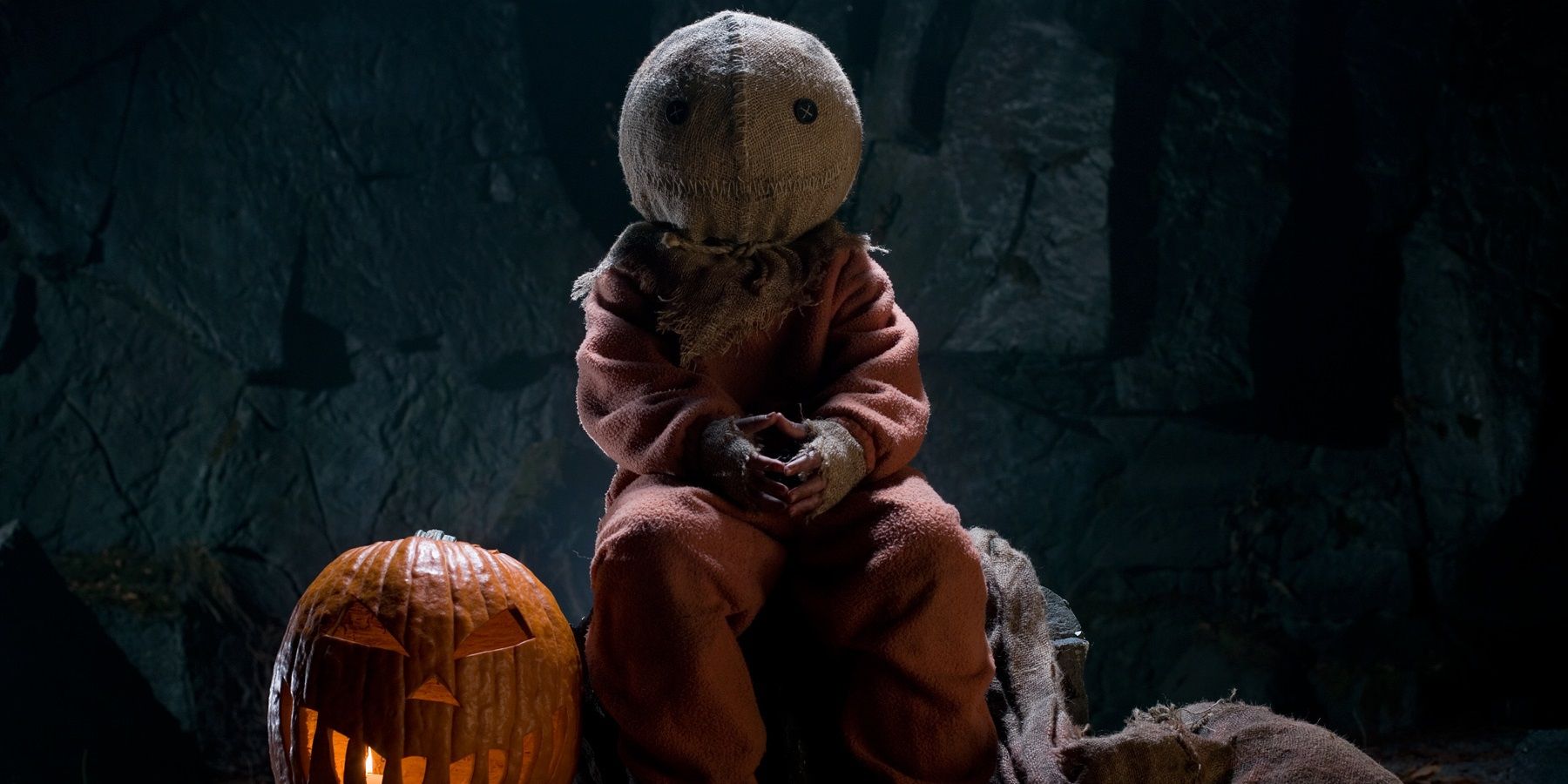 Sam sits with his pumpkin in Trick r' Treat