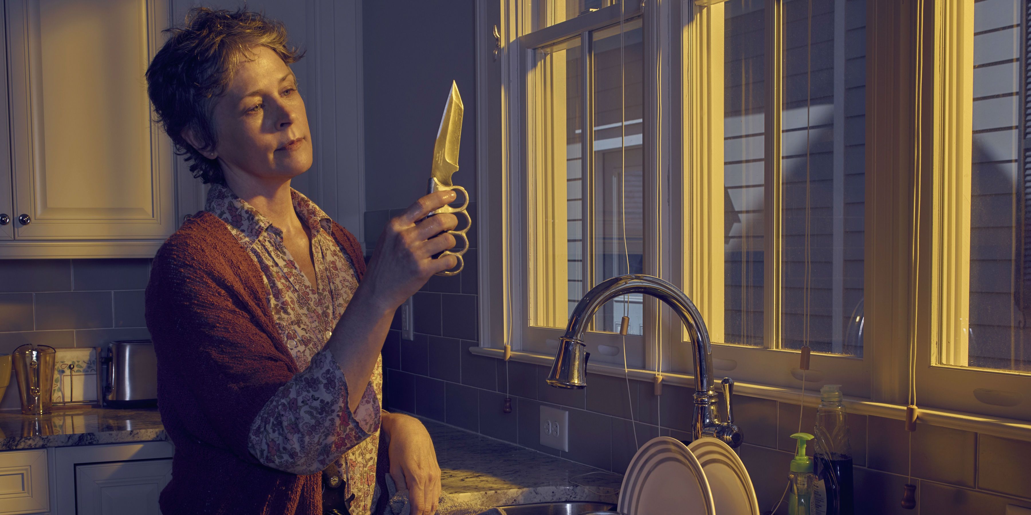 Carol (Melissa McBride) Cleans a Knife in The Walking Dead