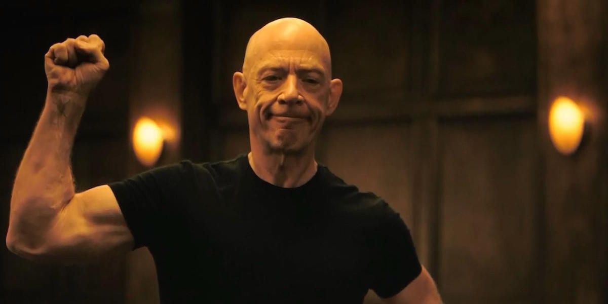 JK Simmons puts his arm in a fist in whiplash