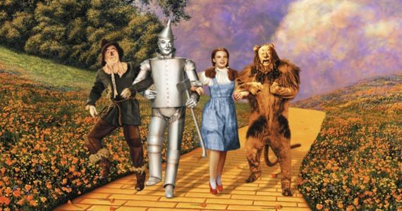 Scarecrow, Tin Man, Dorothy and the Lion on the Yellow Brick Road in The Wizard of Oz.