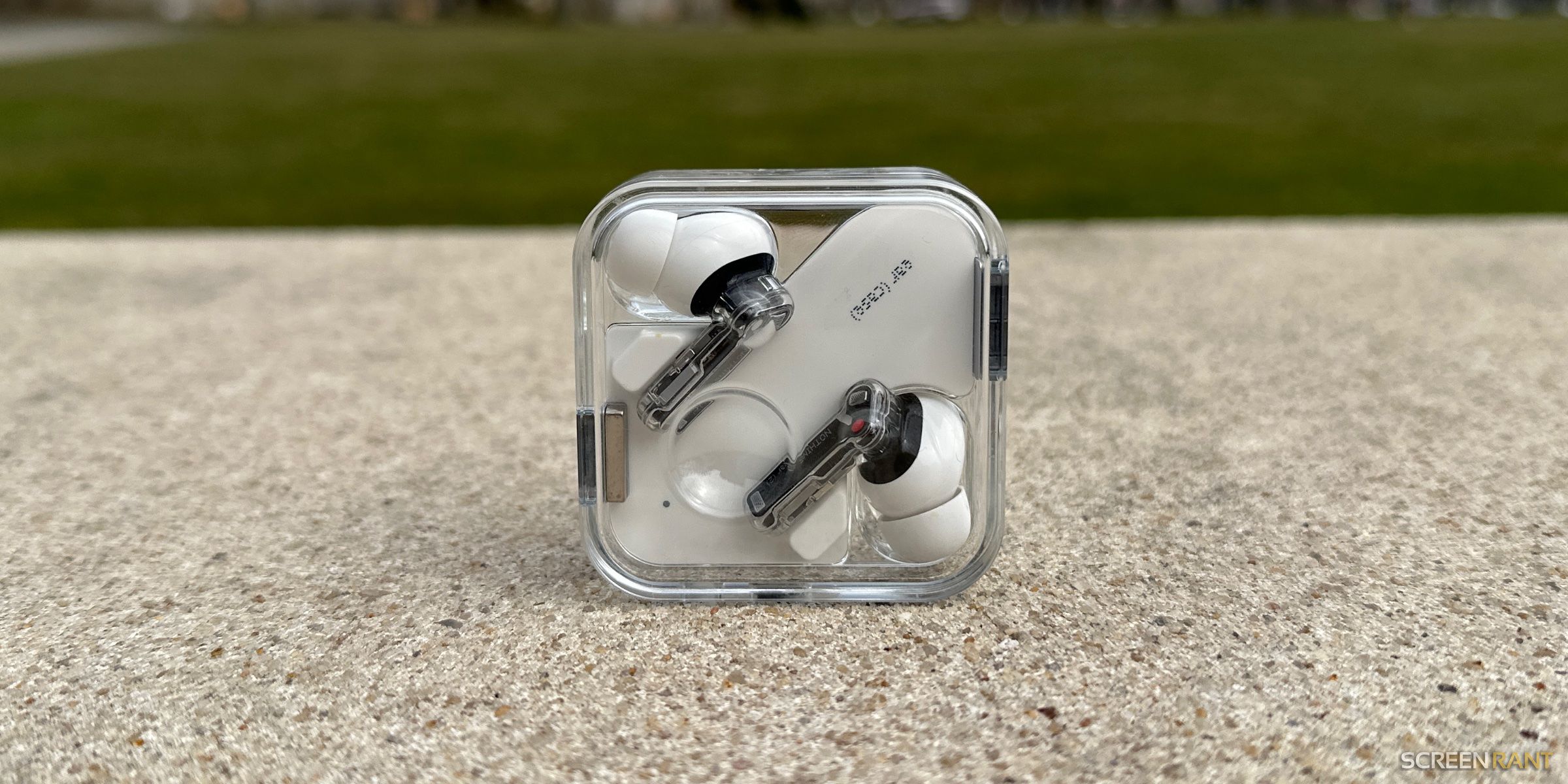 A pair of Nothing's Ear (2) earbuds.