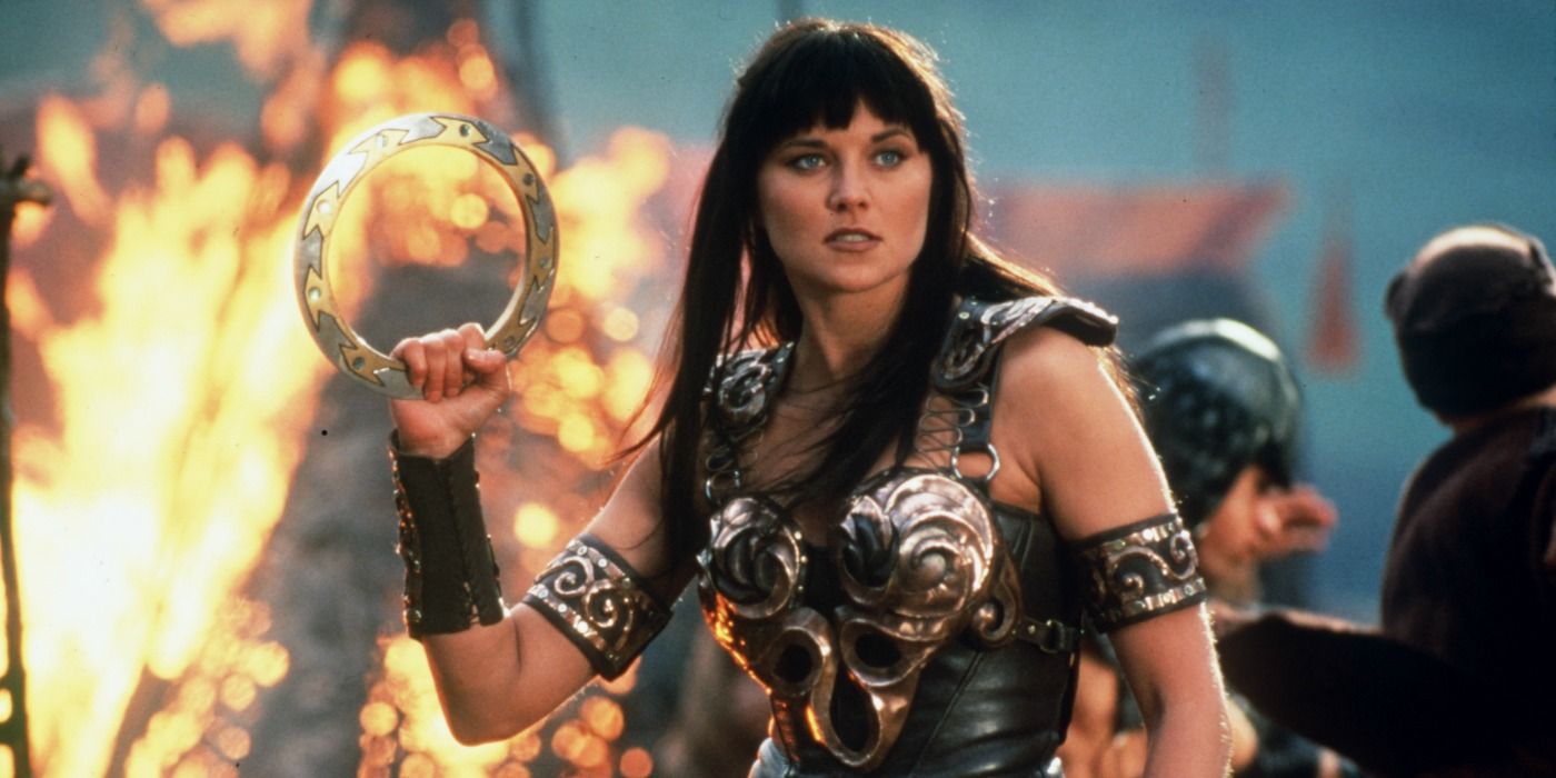 Xena holding up a large ring in Xena: Warrior Princess