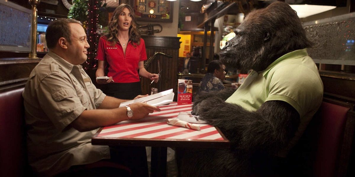 Kevin James sitting in a restaurant with a gorilla in Zookeeper