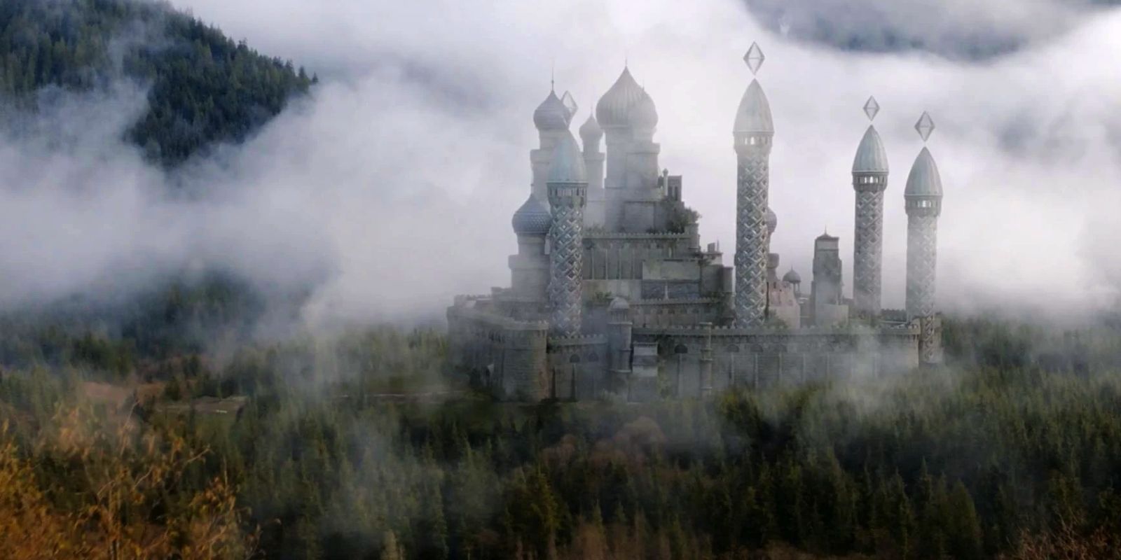 Castle Whitespire in Fillory is covered in fog and surrounded by trees.