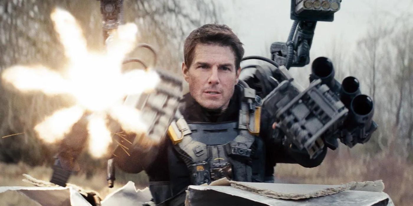 Tom Cruise as Major William Cage firing rounds at enemies in 2014's Edge of Tomorrow