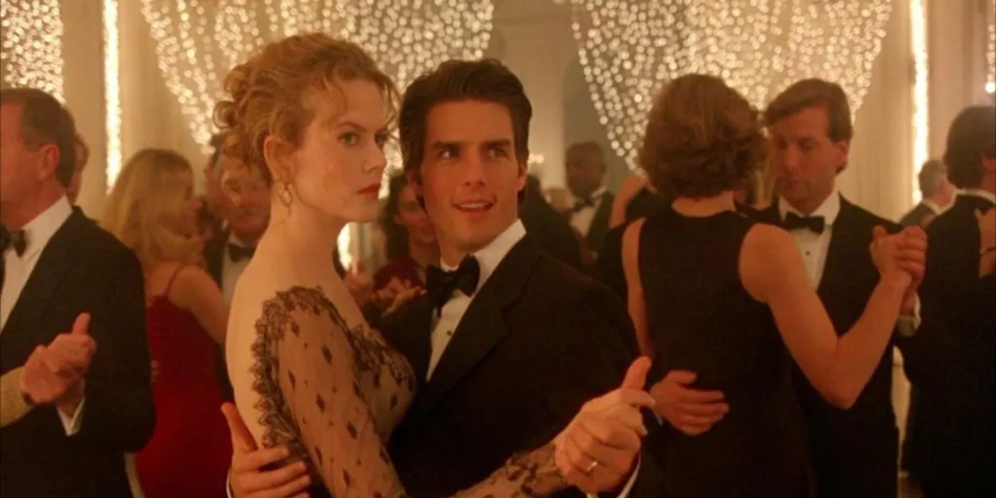 Tom Cruise and Nicole Kidman as Bill and Alice dancing at a party in formal wear in Eyes Wide Shut