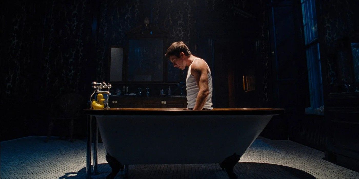 Barry Keoghan as Oliver kneeling in the bathtub in Saltburn