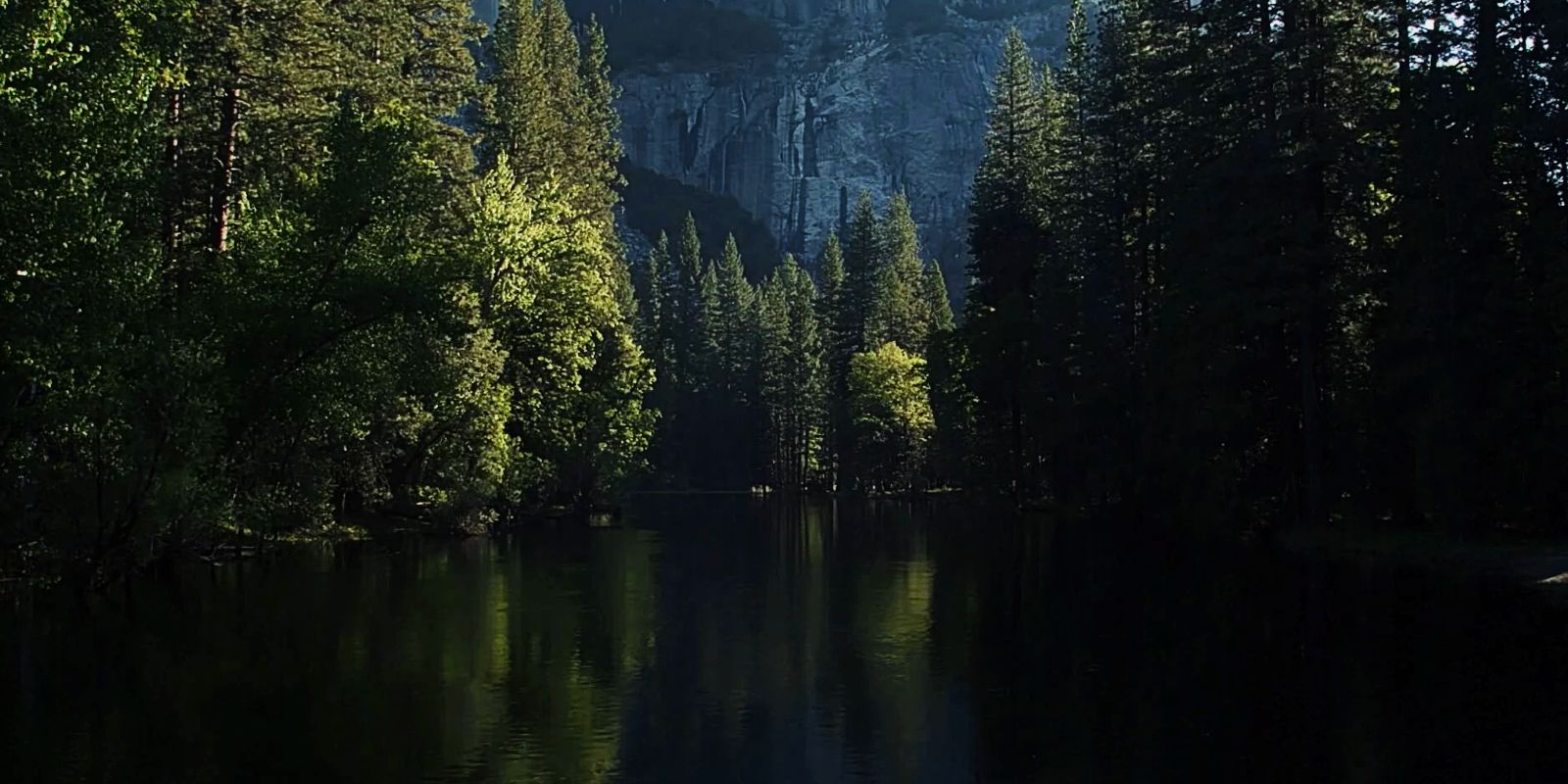 A body of water goes in between pine trees in The Magicians