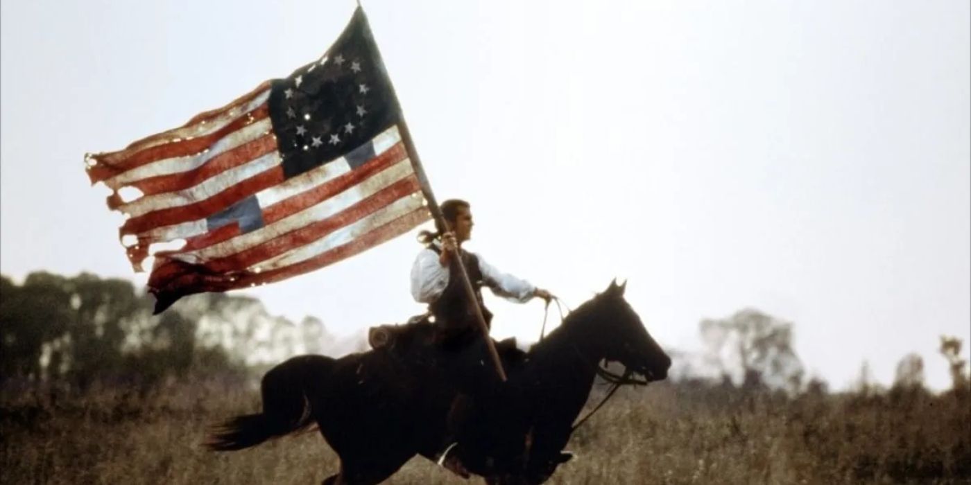 Mel Gibson on horseback with an early American flag in The Patriot - Directed by Roland Emmerich - The Patriot (2000)
