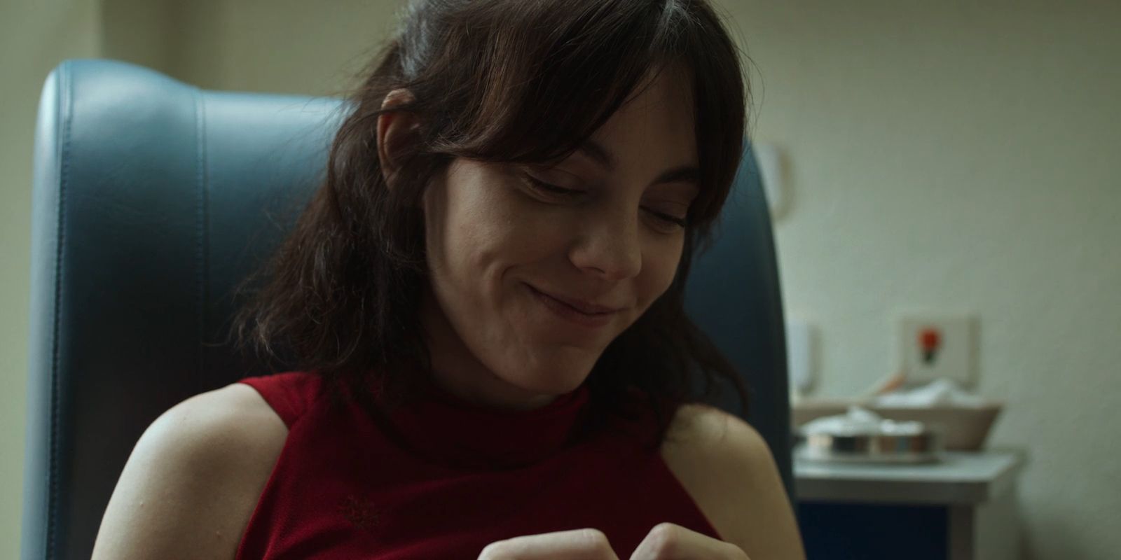 Antonia smiles while looking down in Red Queen - Vicky Luengo As Antonia Scott